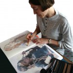 Visionary artist and Reiki Master Natalie Dekel drawing a portrait