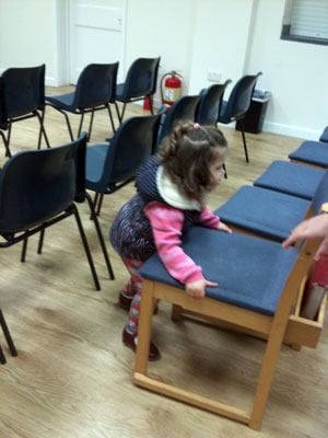 3-years-old, Nicole Dekel, helping sort the chairs for the 21st Sep meeting...