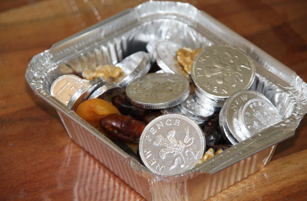 Chocolate coins in tray with fruits, for Hanukka.