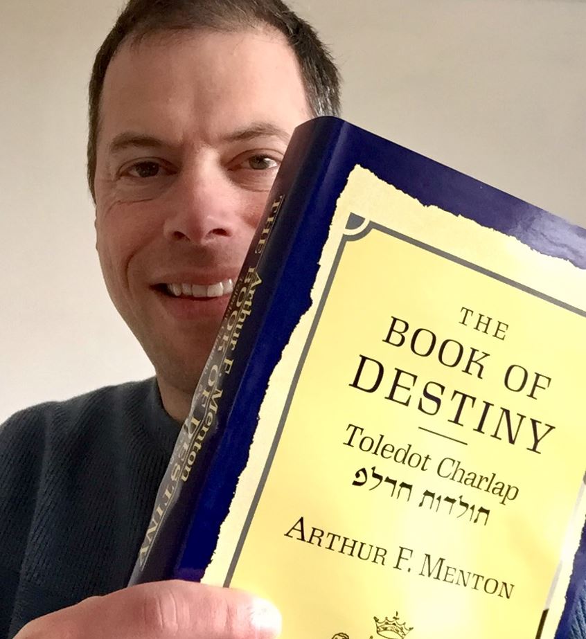 Gil Dekel holding Arthur F Menton Book in 2021