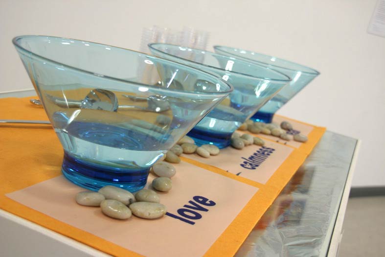 Figure 91: Installation Waterised Words (2007, water, kitchen bowls, printed text, pebble.) Image © Gil Dekel.